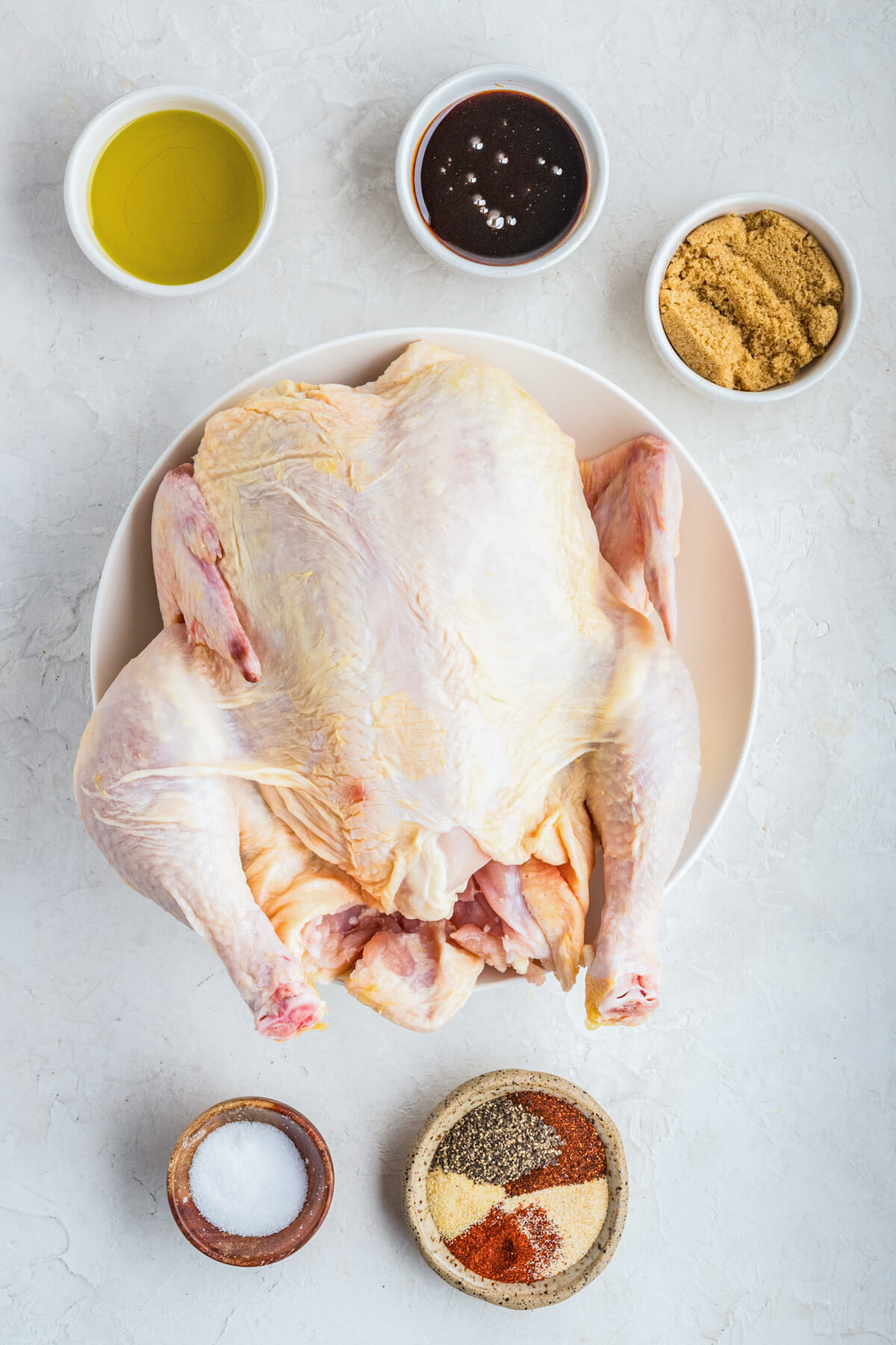 Ingredients required to make a whole Smoked BBQ Chicken.
