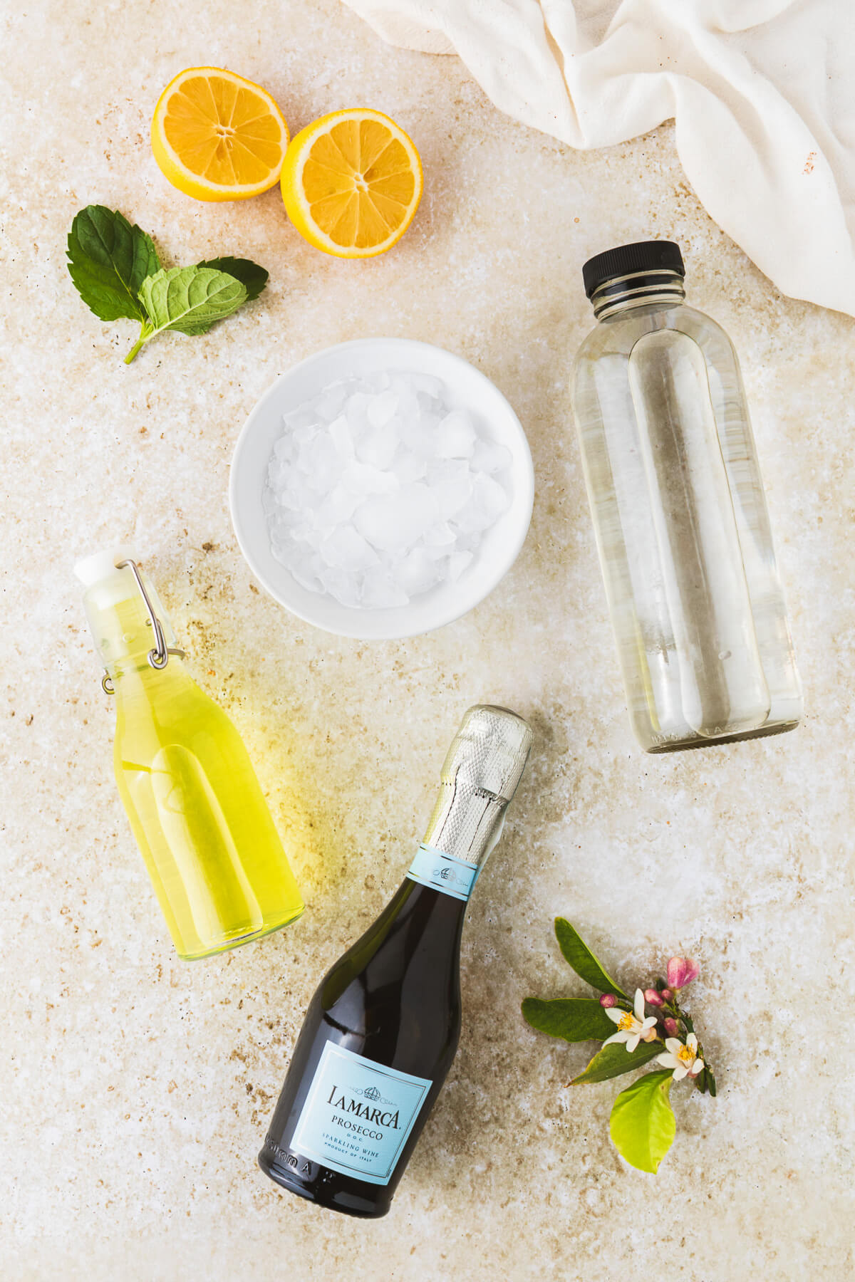 Ingredients required to make and garnish Limoncello Spritz.