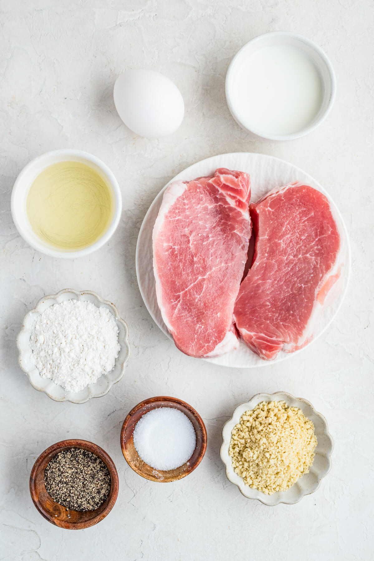 Ingredients required to make pork schnitzel.