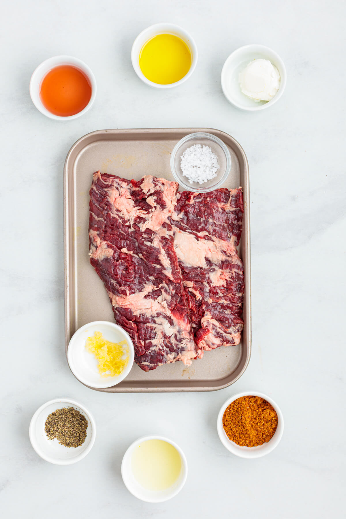 Ingredients required to make homemade beef shawarma using a skirt steak.
