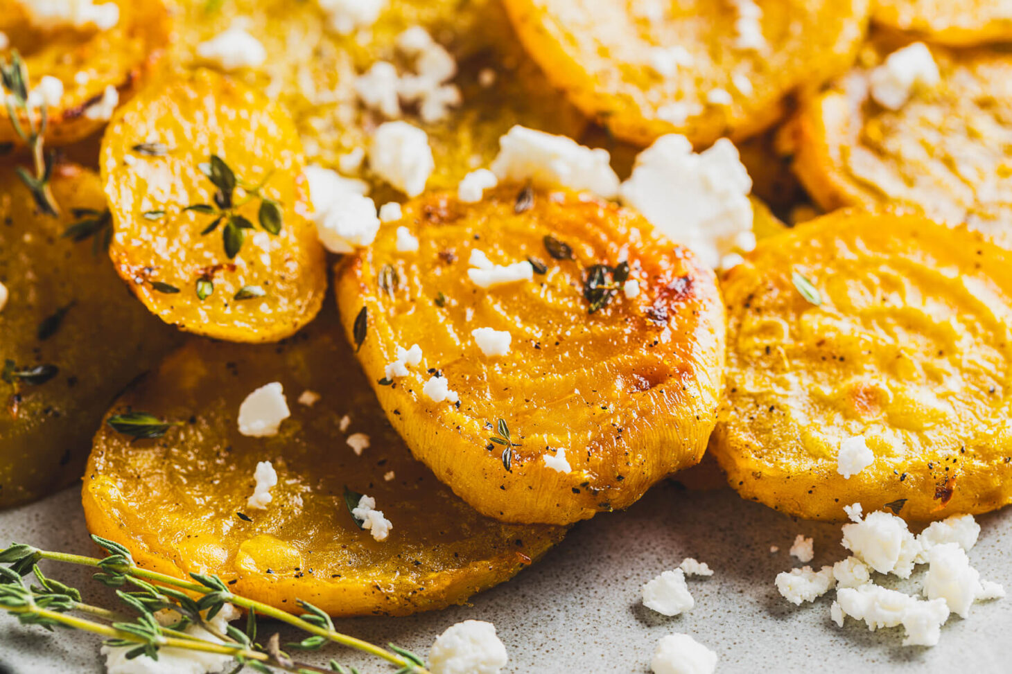 Close up of roasted golden beets showing caramelization.
