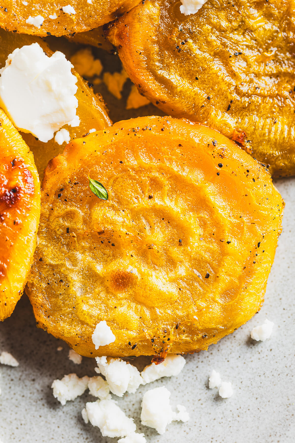 Close up of roasted golden beets showing caramelization.